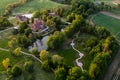 Jaunmoku medieval brick castle complex with pond and park near Tukums, Latvia, drone view