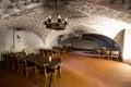 Jaunpils, Latvia - May 15, 2019: A basement reception area and dining room  in medieval 14th Century Jaunpils Castle, now a hotel Royalty Free Stock Photo