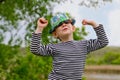 Jaunty macho little boy in a colorful trendy hat