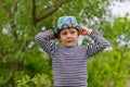 Jaunty macho little boy in a colorful trendy hat