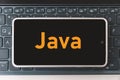 Java Programming language for mobile development, concept. Smartphone on the laptop keyboard, the programmer workplace. Royalty Free Stock Photo