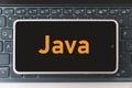 Java Programming language for mobile development, concept. Smartphone on the laptop keyboard, the programmer workplace.