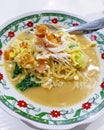 Javanese boiled noodles with shredded chicken and eggs and vegetables