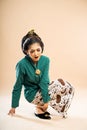 javanese woman in green kebaya touch her ankle in pain