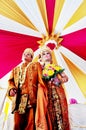 Javanesse Moslem Bride wear beskap and Groom wear batik in Traditional Wedding Royalty Free Stock Photo