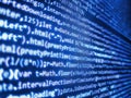 Javascript code in bracket software. Binary and source code malware background. Programming html application code running down a Royalty Free Stock Photo