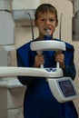 Jaw computed tomography, check up teeth in dental clinic. Boy with open mouth on x-ray diagnostics. Circular snapshot.