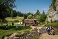 Hiking tourists watching a truck loaded with wood logs in Biala Woda valley in Pieniny mountains, Poland .