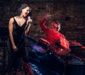 Jazz band performance. Couple of musicians - a drummer and a singer in a nightclub. Royalty Free Stock Photo