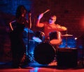 Jazz band performance. Couple of musicians - a drummer and a singer in a nightclub. Royalty Free Stock Photo