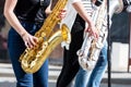 Jazz band of young musicians with saxophones performing during m