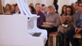 A jazz concert in the concert hall. Piano and audience on a background