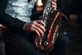 Jazz man hands holding saxophone closeup Royalty Free Stock Photo