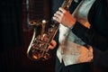 Jazz man hands holding saxophone closeup Royalty Free Stock Photo