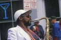 Jazz musician performing on the French Quarter, New Orleans at Mardis Gras, LA