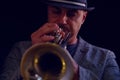 A jazz musician plays a silver trumpet Royalty Free Stock Photo