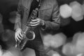 Jazz saxophone player in performance on the stage. color filter