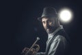 Jazz trumpet player on a dark background