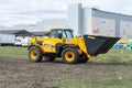 The JCB bucket loader, Tractor at a demonstration site agro exhibition AgroExpo. Tractor rides on the field. Kropivnitskiy,