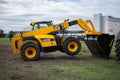 The JCB bucket loader, Tractor at a demonstration site agro exhibition AgroExpo. Tractor rides on the field. Kropivnitskiy,