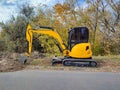 JCB digger or excavator performs excavation work outdoors Royalty Free Stock Photo