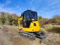JCB digger or excavator performs excavation work outdoors Royalty Free Stock Photo