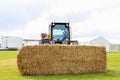 Jcb teleskid with bale of straw hay Royalty Free Stock Photo