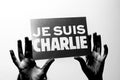 Je Suis Charlie in French language in black hands Royalty Free Stock Photo