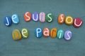 Je suis fou de Paris, I am crazy about Paris, creative slogan with stone colored letters over green sand Royalty Free Stock Photo