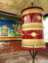 Je Tsongkhapa pictured behind a prayer wheel, located in the steps that lead to the main part of Thiksay monastery.