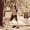 Jealous girl looking at flirting couple outdoor. Royalty Free Stock Photo