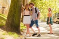 Jealous girl looking at flirting couple outdoor. Royalty Free Stock Photo