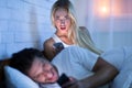 Jealous Girlfriend Catching Boyfriend Texting With Women Lying In Bed