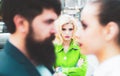 Really jealous of him. Jealous woman look at couple in love on street. Romantic couple of man and woman dating. Bearded Royalty Free Stock Photo