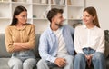 Jealous Lady Looking At Flirting Couple Sitting Together At Home Royalty Free Stock Photo