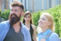 She is jealous. Unhappy girl feeling jealous. Bearded man cheating his girlfriend with another woman. Jealous woman look Royalty Free Stock Photo