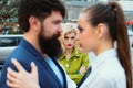 Jealous woman look at couple in love on street. Really jealous of him. Romantic couple of man and woman dating. Bearded Royalty Free Stock Photo