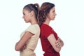 Jealous Women Standing with Backs to Each Other. Royalty Free Stock Photo