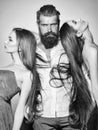 Jealousy and love. Bearded man and two women Royalty Free Stock Photo