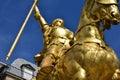 Jeanne dÃ¢â¬â¢Arc 1874 gilded bronze equestrian sculpture with blue sky. Place de Pyramides, Paris, France. Royalty Free Stock Photo