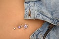 Jeans and bellybutton piercing Royalty Free Stock Photo