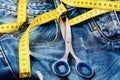 Jeans belt loops, zipper and pocket with scissors, selective focus. Royalty Free Stock Photo