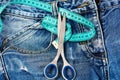 Jeans with scissors and measure tape, top view Royalty Free Stock Photo