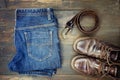 Jeans belt and shoes set on wood