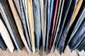 Jeans in blue and various colors arranged in vertical rows