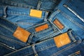 Jeans with brown leather labels background Royalty Free Stock Photo