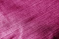 Jeans cloth pattern with blur effect in pink tone.