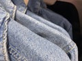 Jeans Clothes On a Rack, Stylish clothes on hangers, Clothing store, new autumn and winter collection, closeup