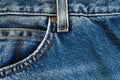 Jeans denim, pants front pockets, seams with orange threads, close-up macro view Royalty Free Stock Photo