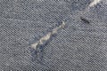 Jeans fabric with fissure Royalty Free Stock Photo